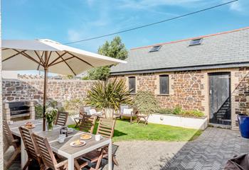 The garden has plenty of seating for guests to enjoy al fresco dining or simply relaxing in the sun.