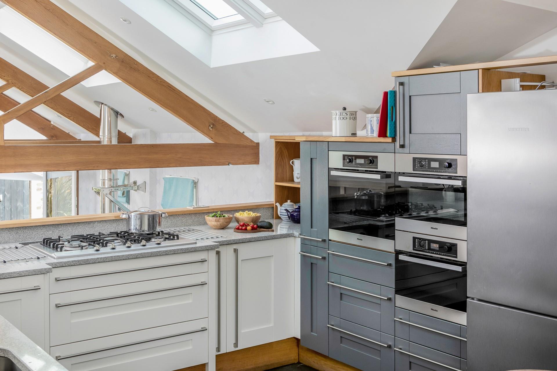 The kitchen has all the appliances you need including a double oven and coffee maker.