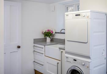 The utility room has a washing machine and tumble dryer perfect for washing beachwear.