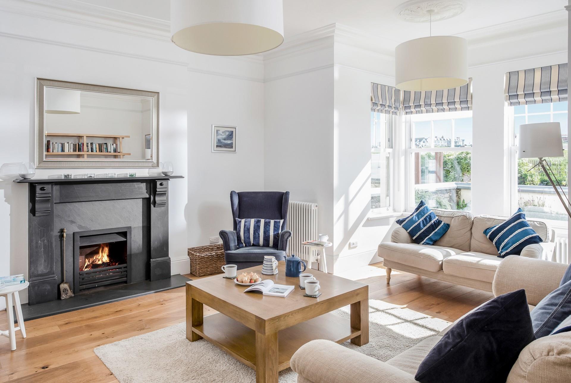 The open fireplace makes the sitting room cosy in the winter months.