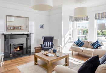 The open fireplace makes the sitting room cosy in the winter months.