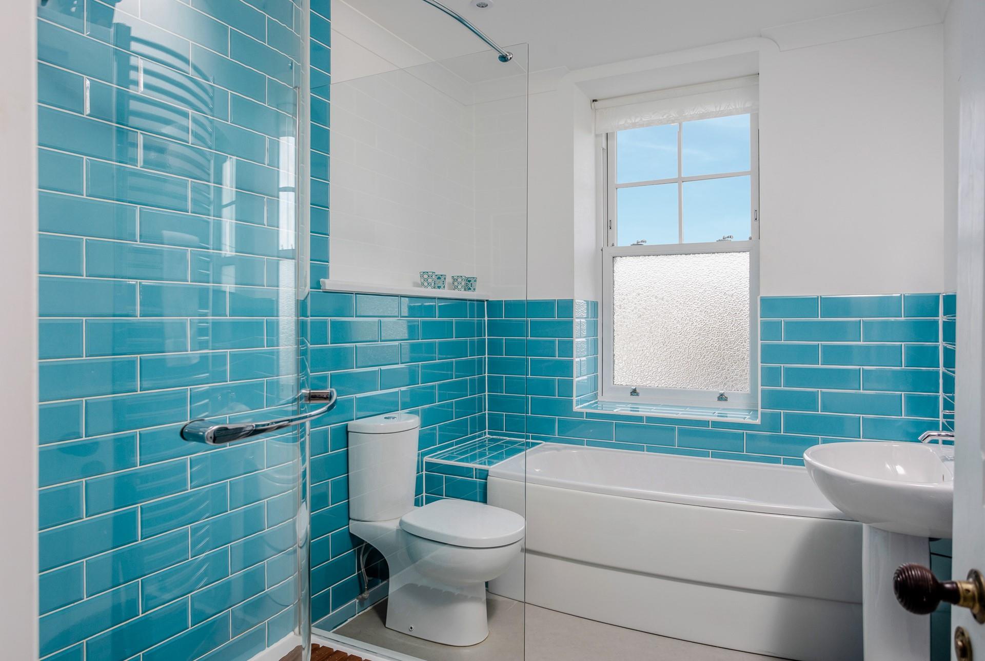 The bathroom has a bath or shower to choose from each morning.