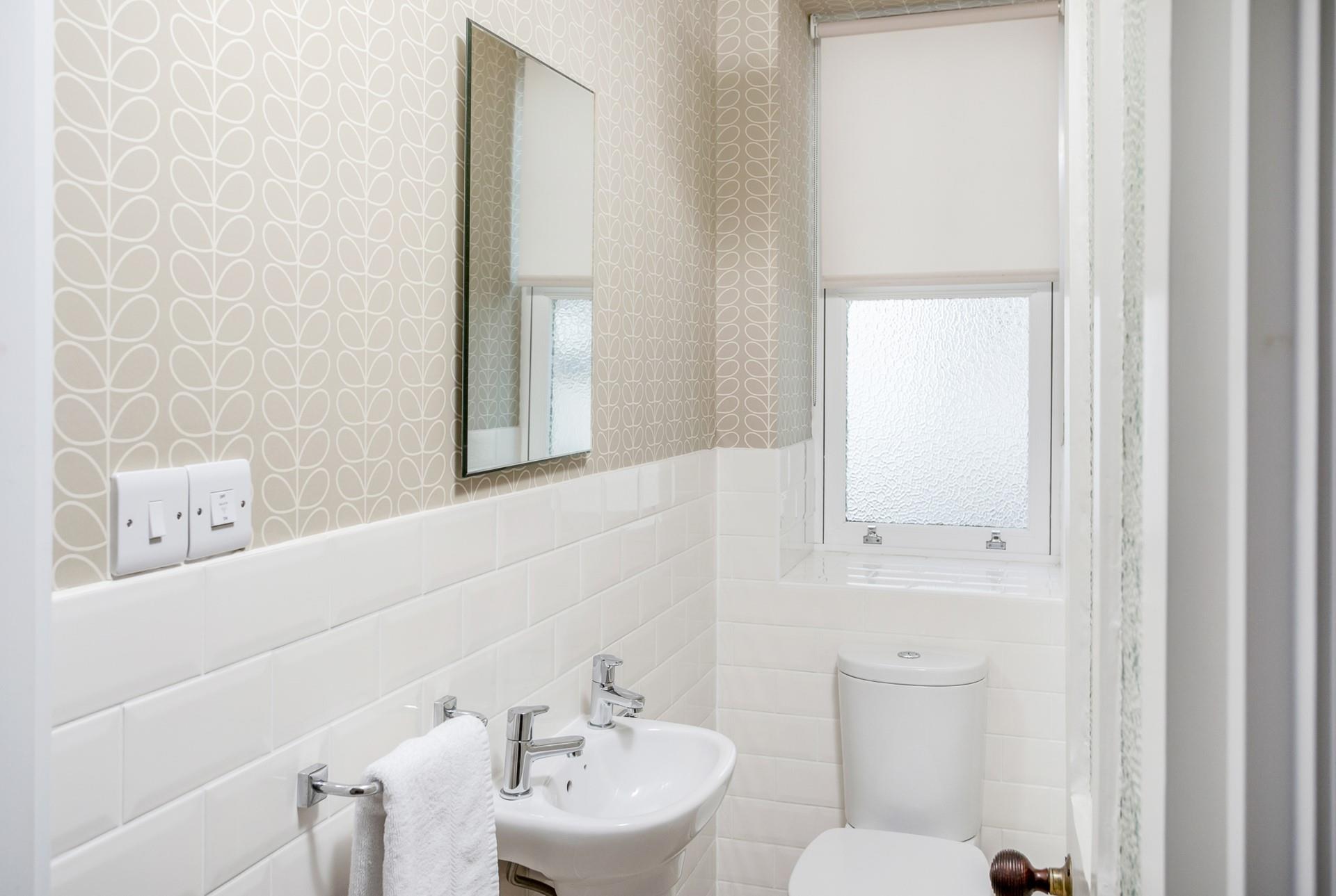 The downstairs cloakroom has an additional WC and basin.