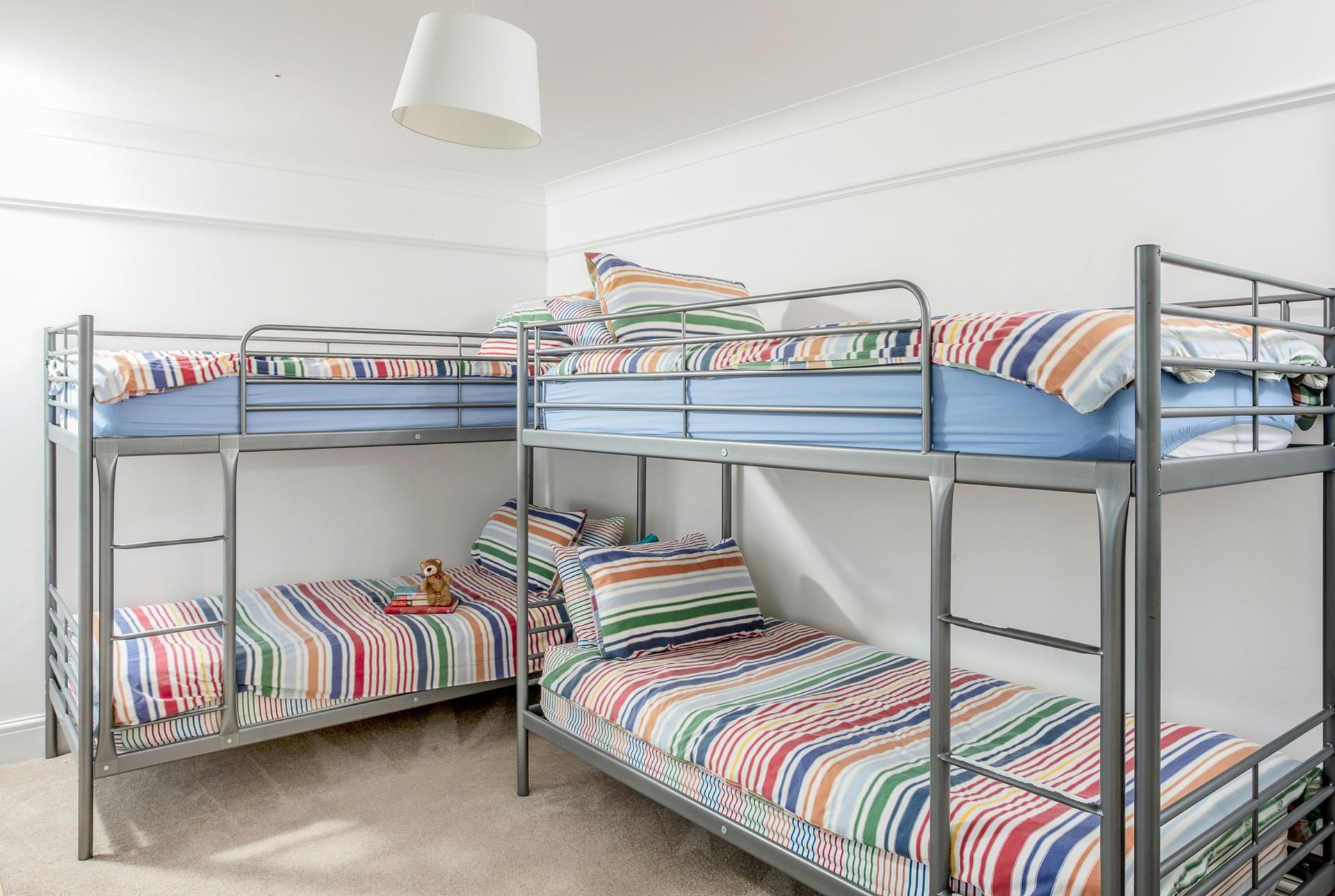 Bedroom 4 has two sets of bunk beds perfect for a kid's sleepover!