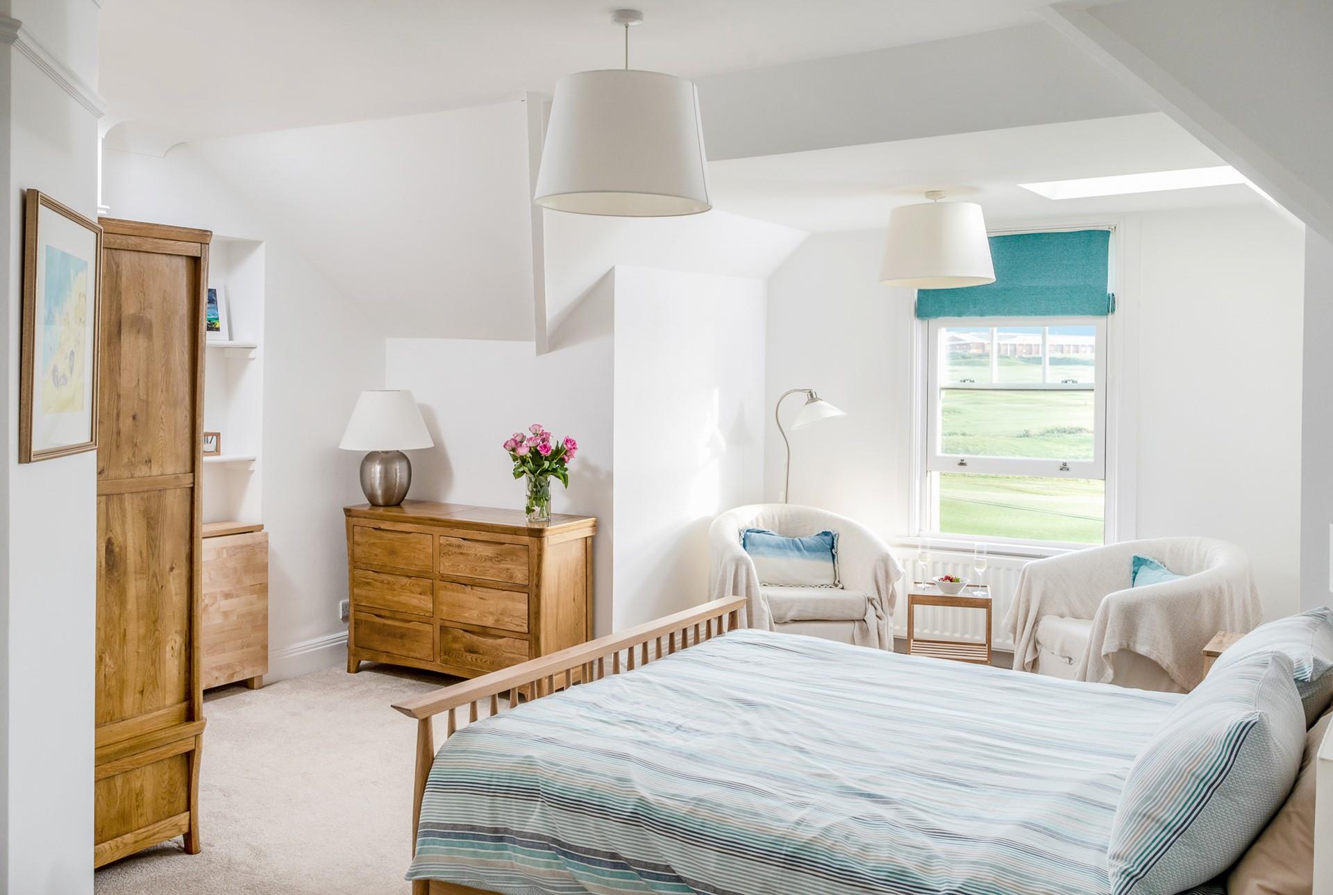 The spacious king size bed provides a sumptuous night's sleep.