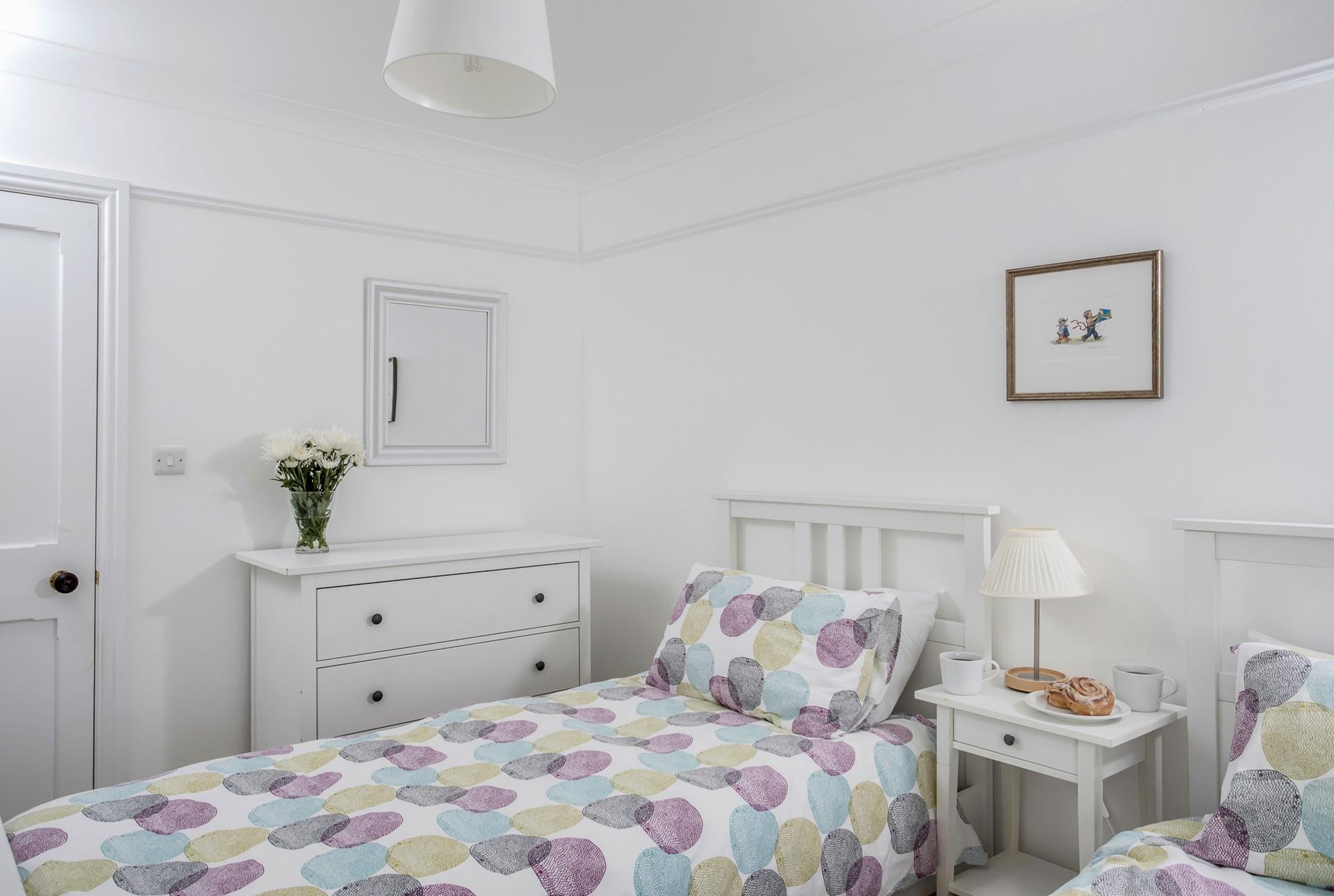 Bedroom 7 has twin beds and provides flexible sleeping arrangements.