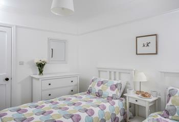 Bedroom 7 has twin beds and provides flexible sleeping arrangements.