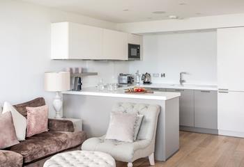 The compact kitchen is well-equipped with all you need for a relaxing break by the sea.