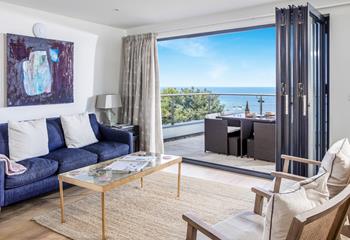 Open the bi-fold doors and let the sea breeze into the apartment.