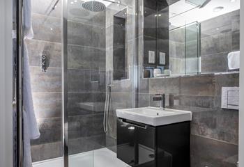Step into the en-suite and under the rainfall shower.