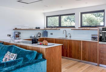 The stylish kitchen boasts sleek, modern amenities.