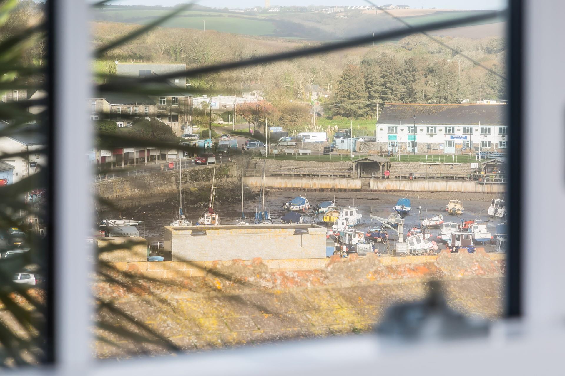 Watch the boats bobbing on the harbour and the town wake up.