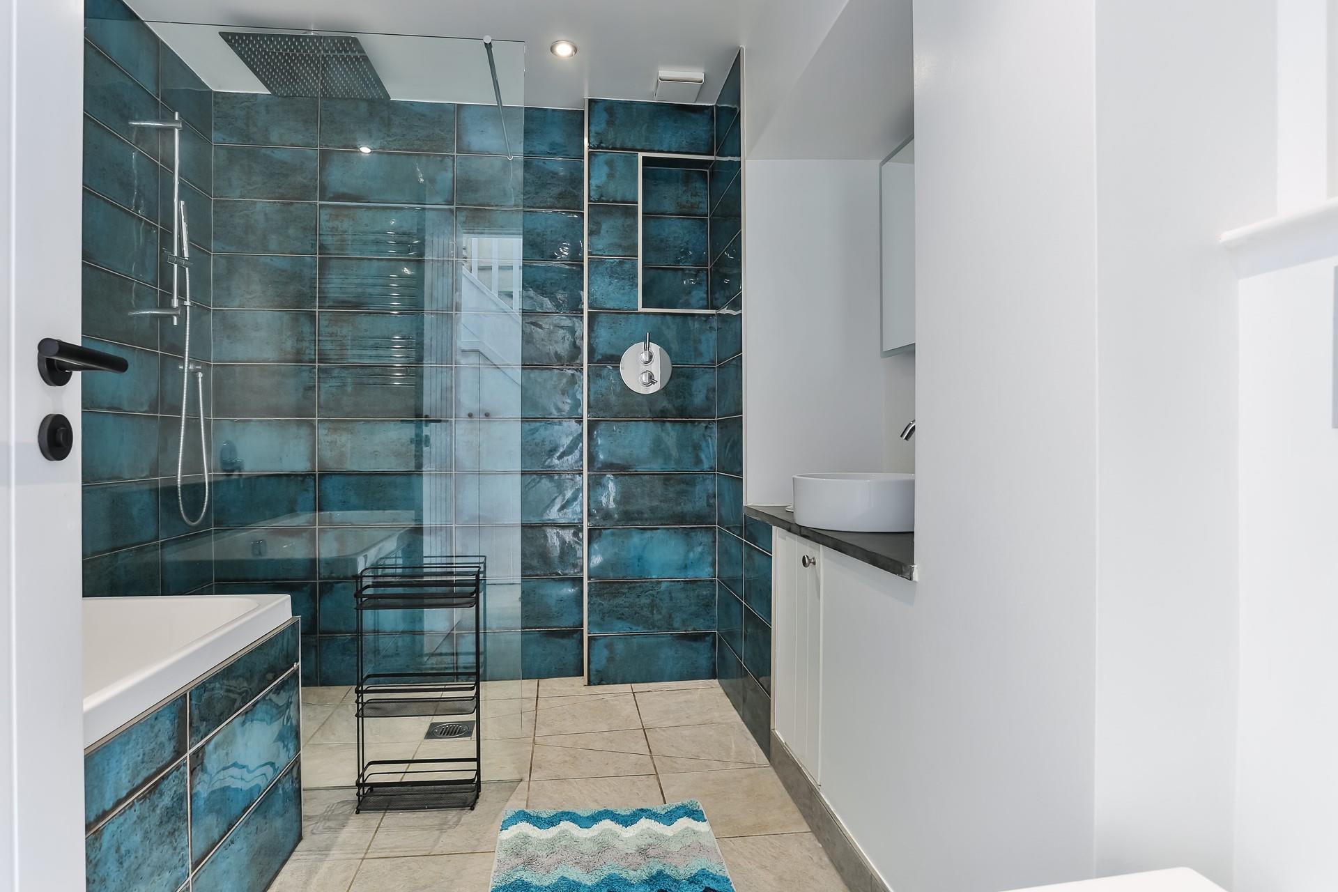 The family bathroom is a modern and stylish space to get ready.