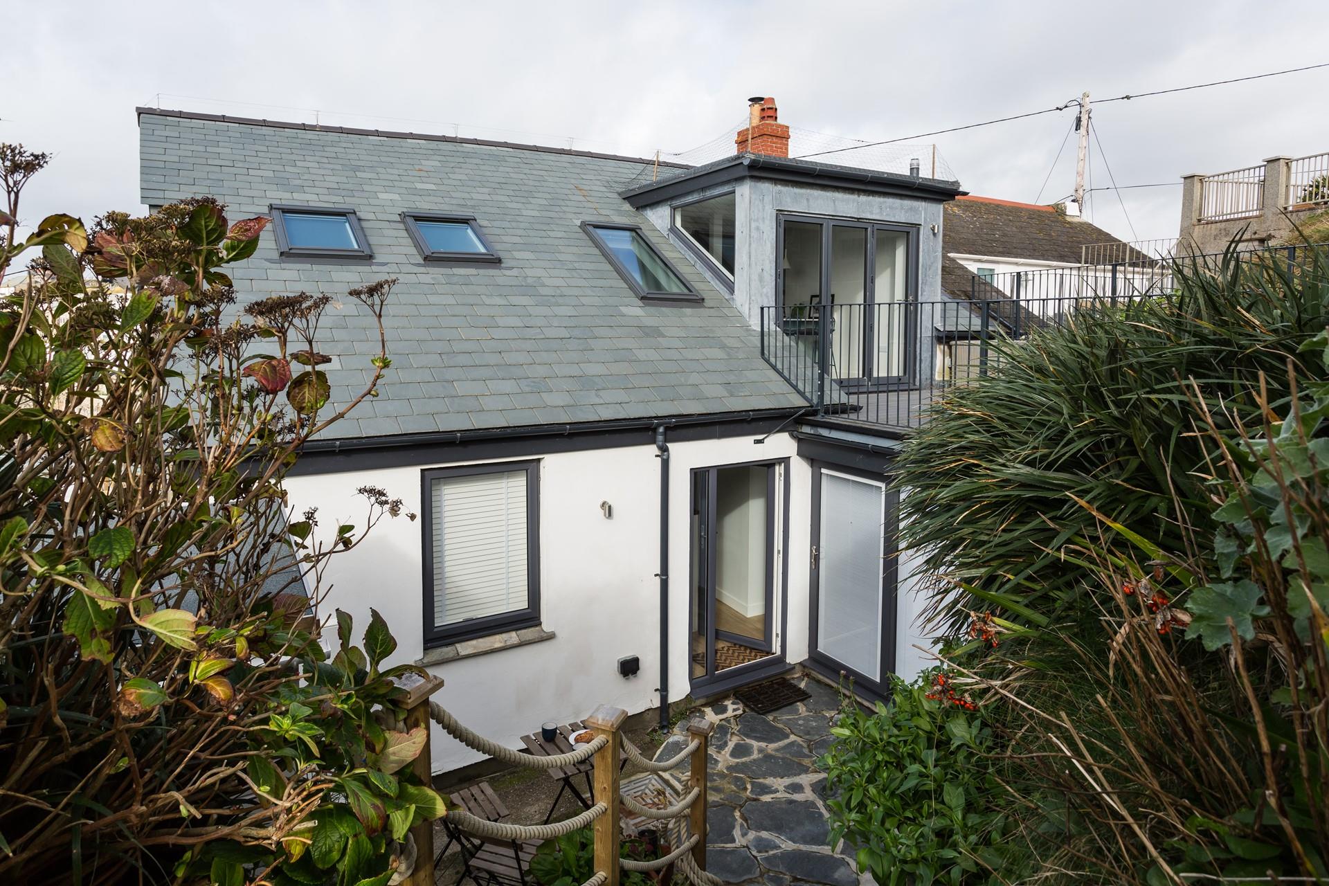 Head outside to check the day's weather and make a plan for the day.