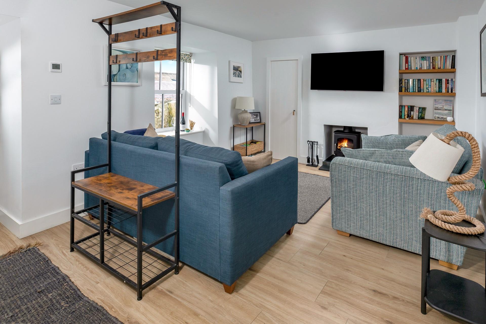 The cosy sitting room is perfect for nights in after days of exploring.