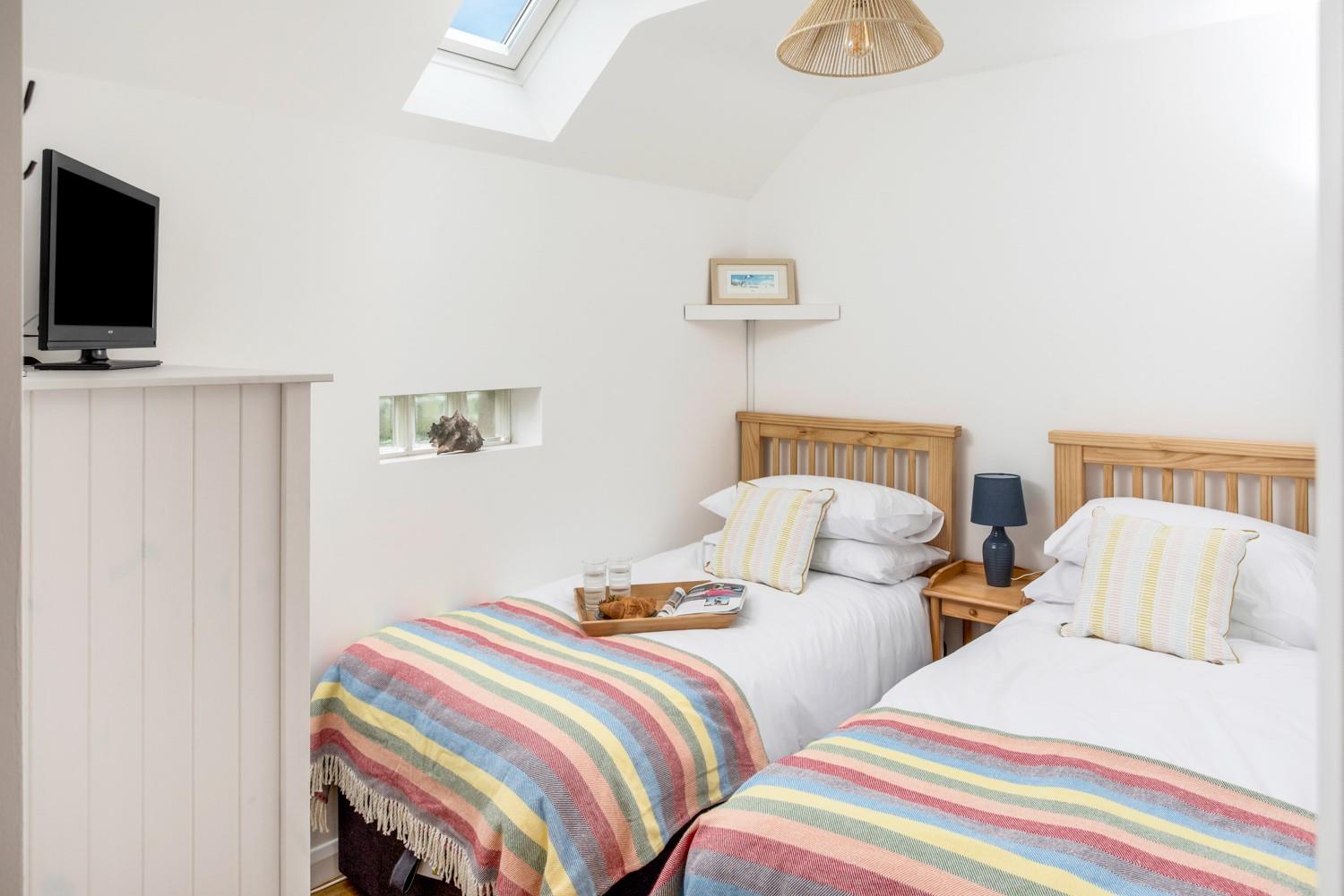 Bedroom 2 is a colourful twin, sure to delight adults or children.