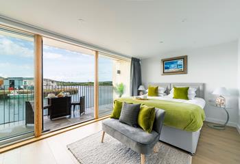 Bedroom 2 has a sumptuous king size bed and a balcony to enjoy al fresco dining.