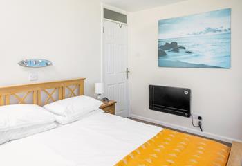 After spending days in the surf, you'll sleep soundly in the master bedroom.