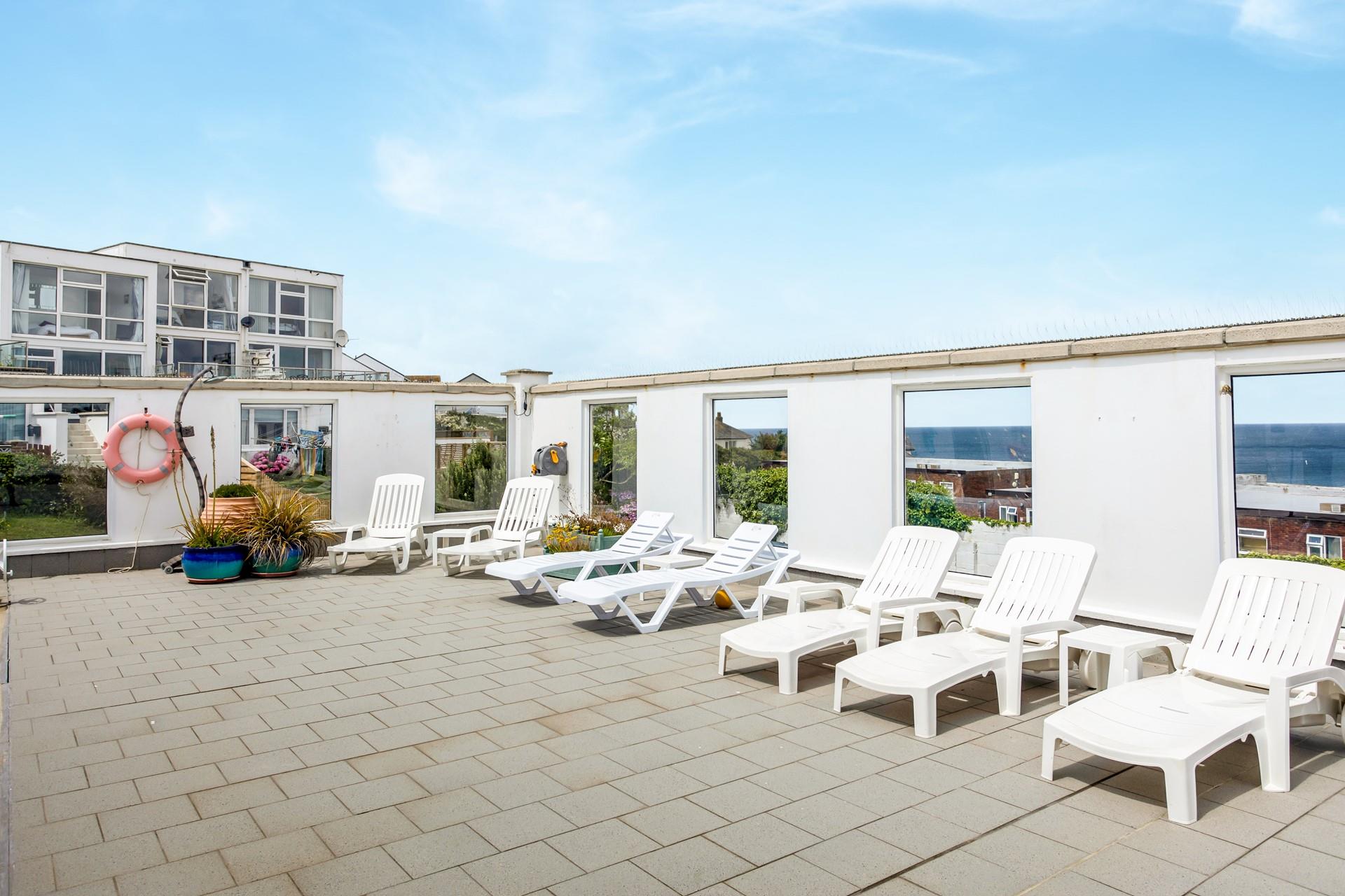 Lie back and relax by the pool with a good book.