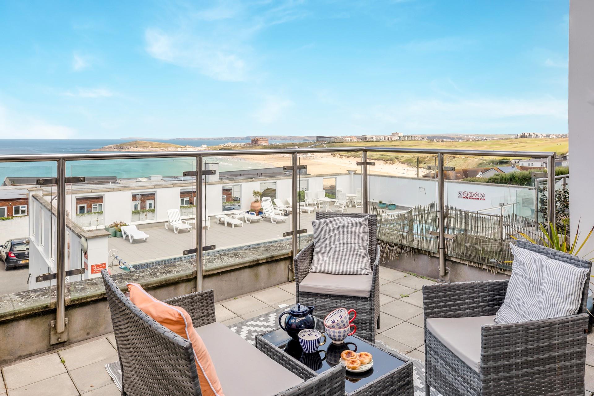 Unwind on the balcony, which overlooks the communal outdoor pool.