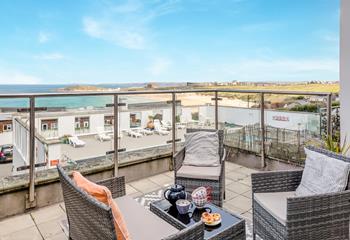 Unwind on the balcony, which overlooks the communal outdoor pool.