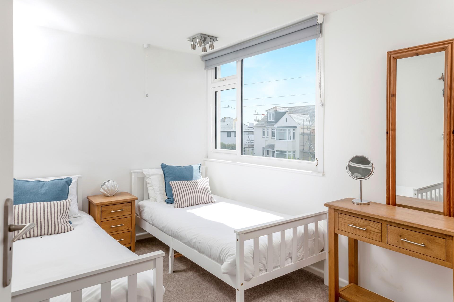 The light and bright second bedroom is perfect for children or adults.