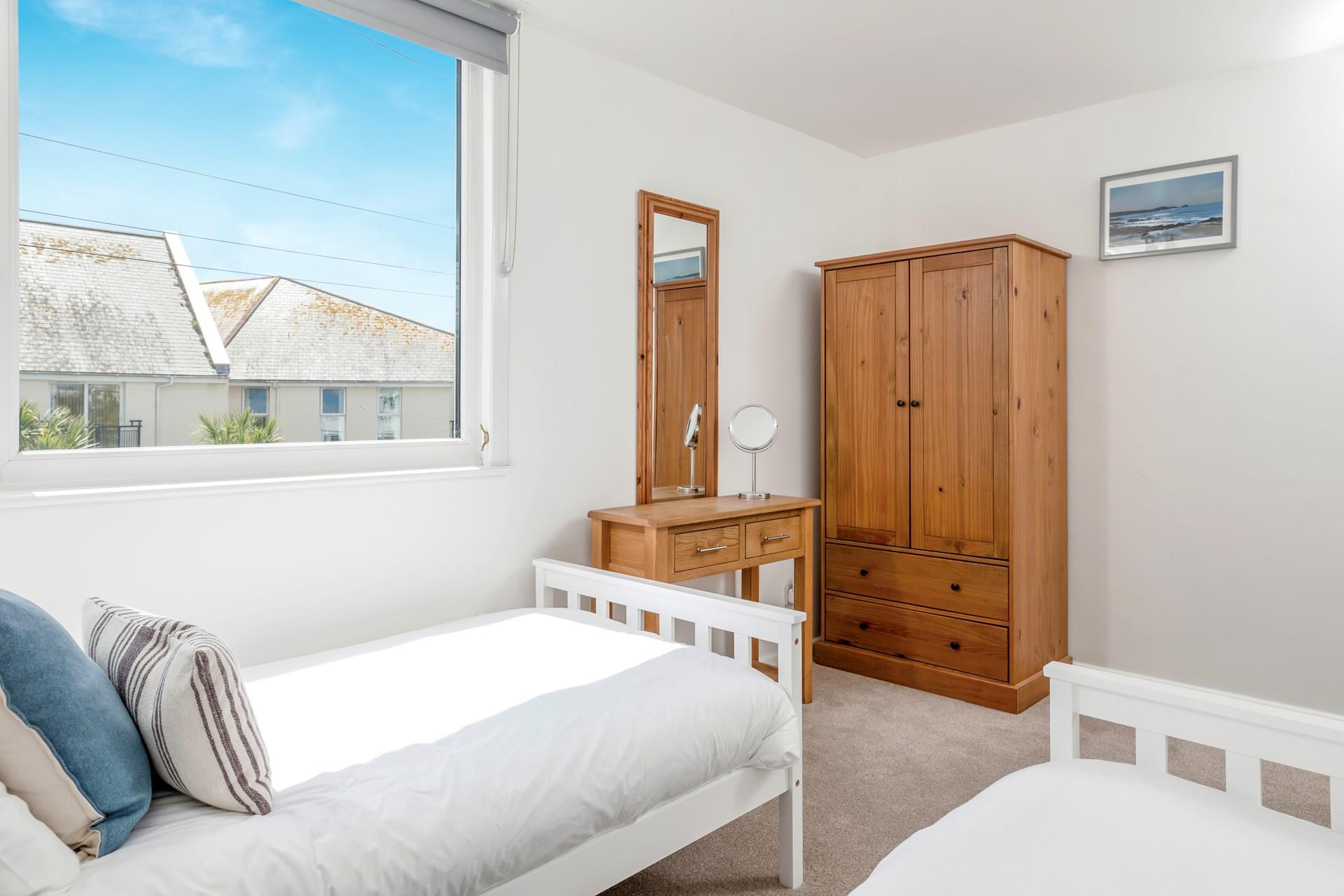 The twin bedroom has a handy wardrobe for all the holiday essentials.