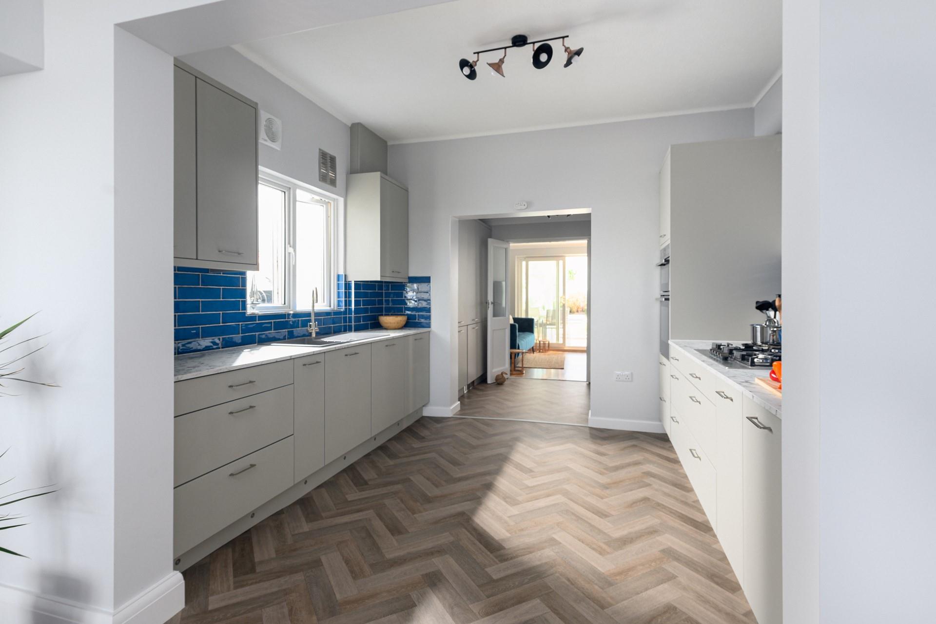 The sleek kitchen has everything you need for a relaxing stay.