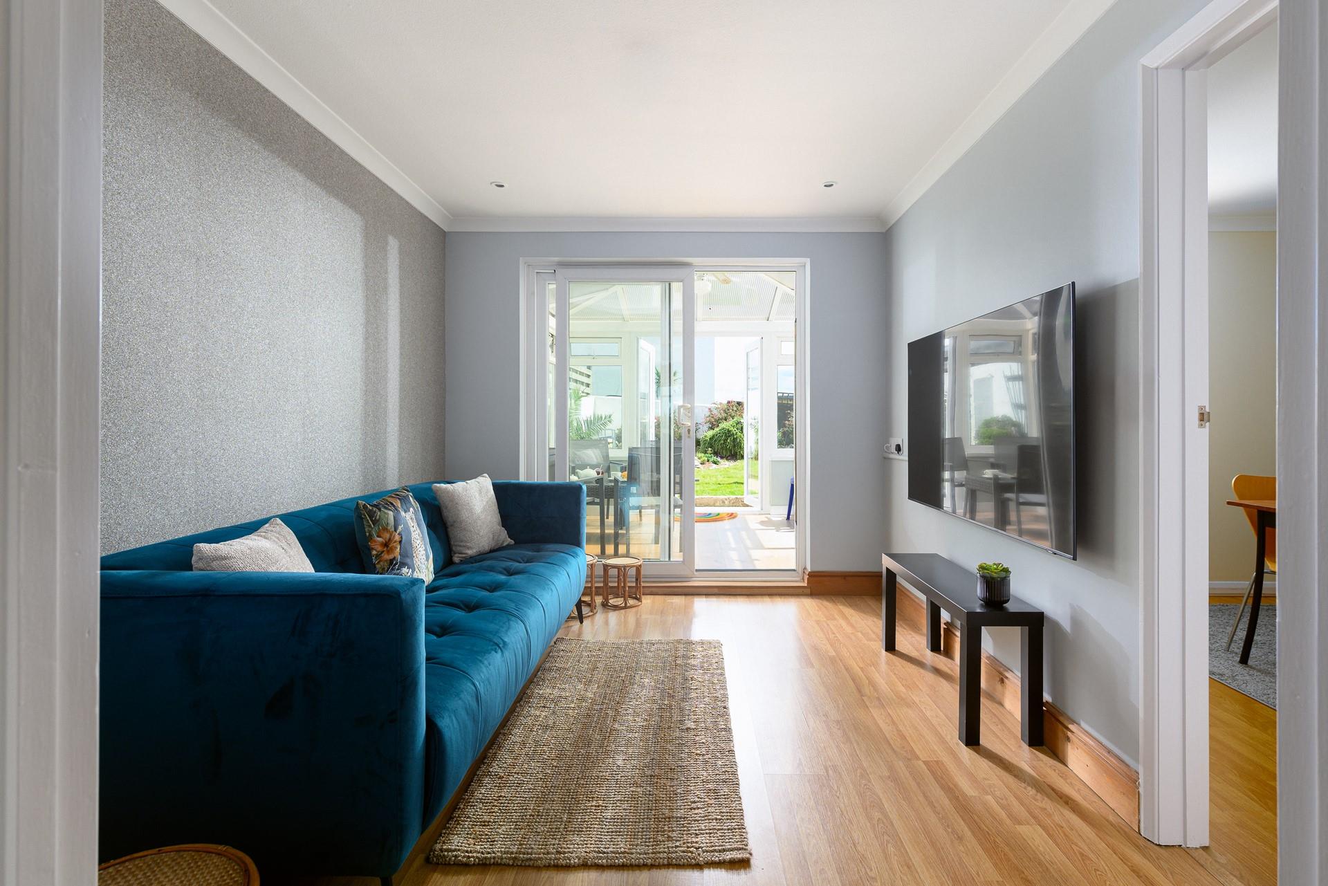 The snug boasts a flat screen TV, perfect for a movie night.