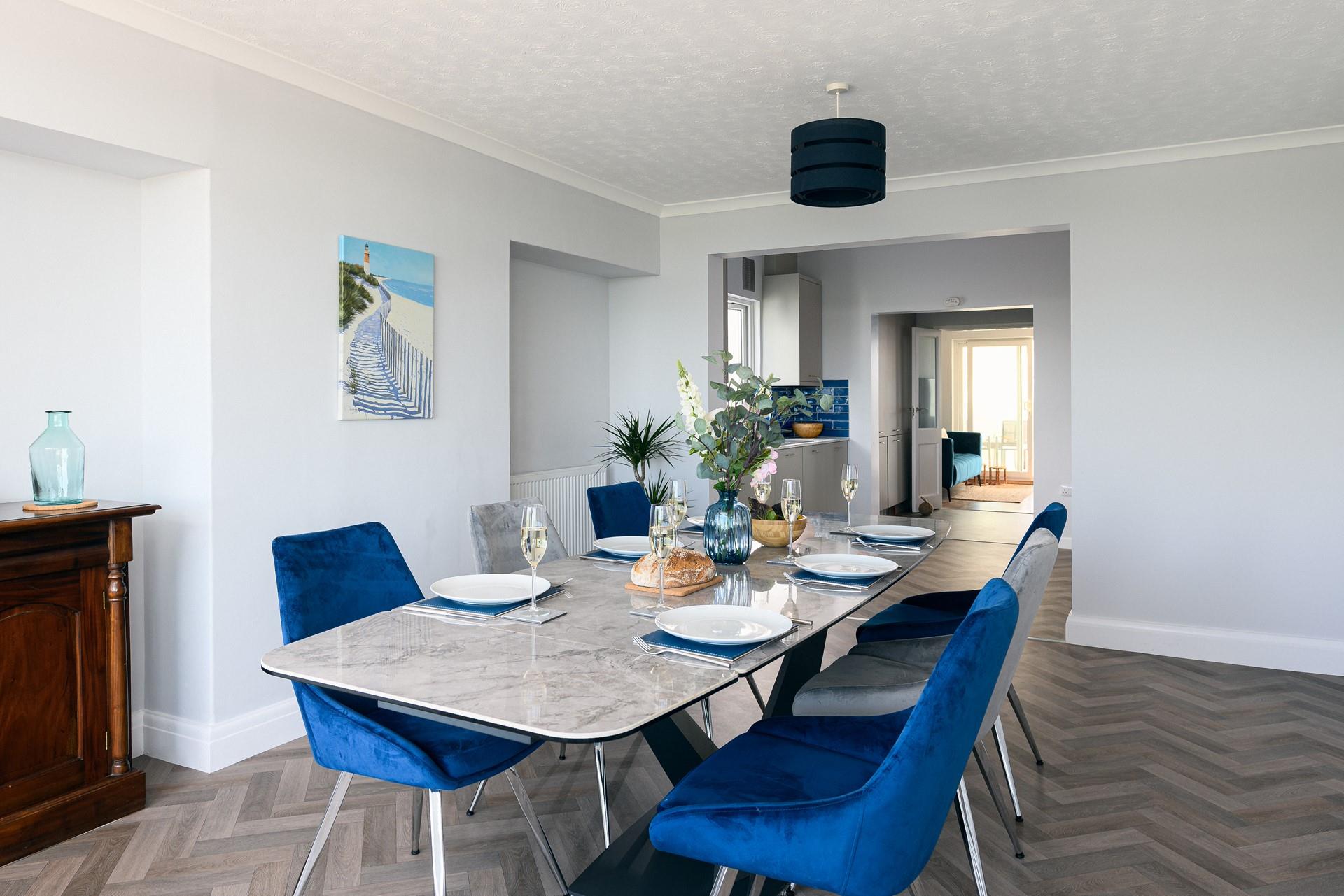 The serene coastal decor creates a lovely space for holiday mealtimes.