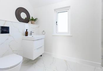 The bathroom is modern and stylish for getting ready each day.