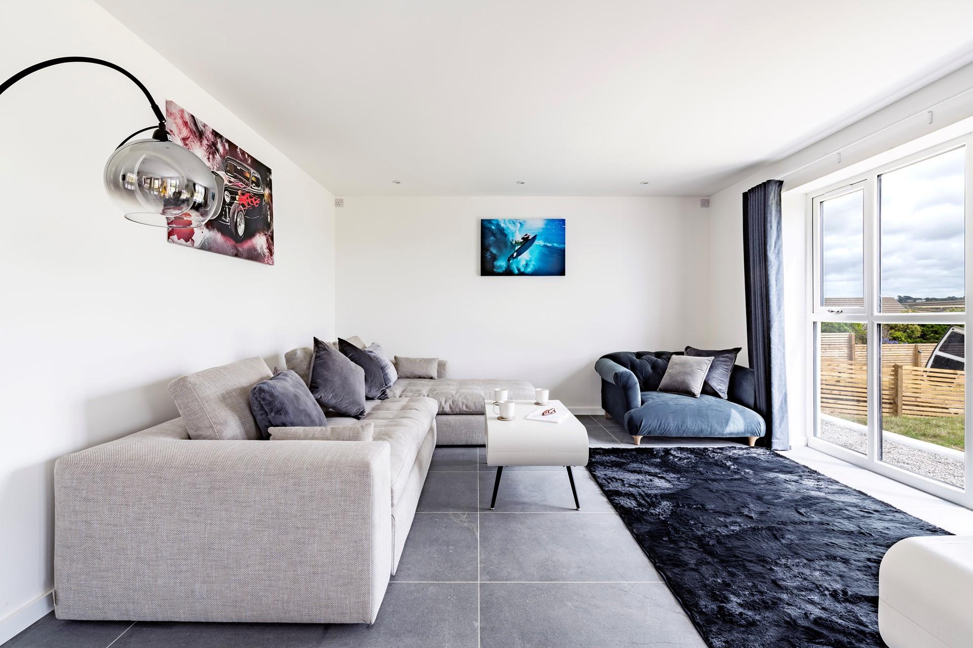 Sink into the sumptuous L-shaped sofa and relax after a walk along the coast path.