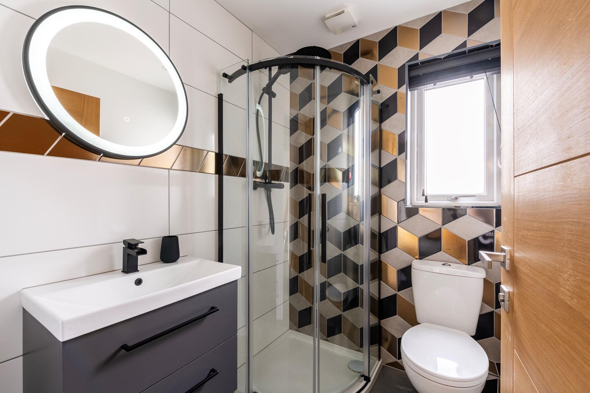 Wash off sandy toes in the downstairs shower room after a day on the beach.