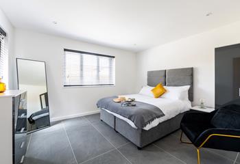Bedroom 1 is on the ground floor and is decorated with neutral grey tones.