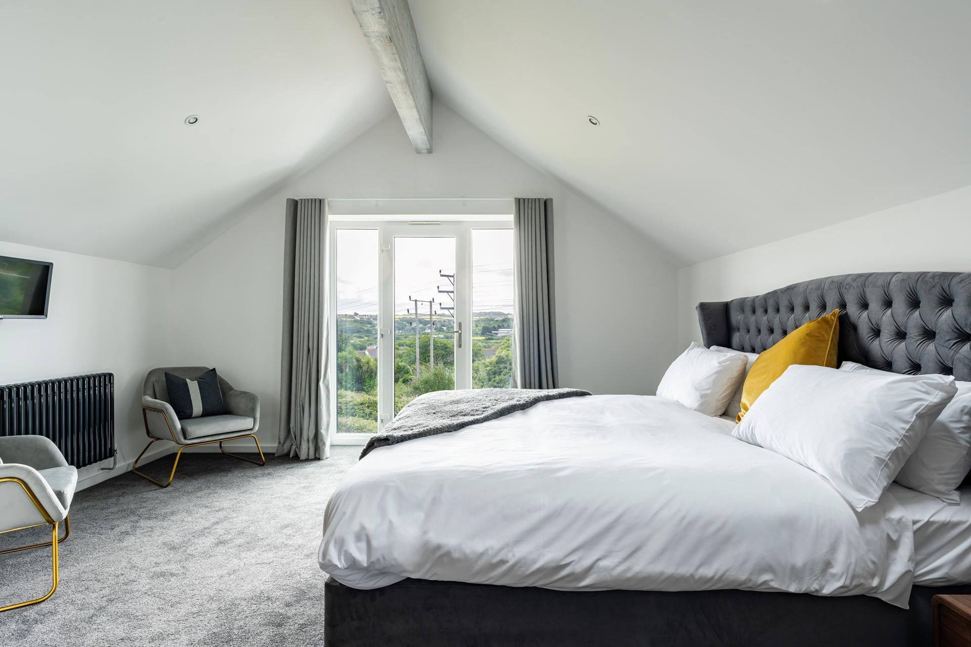 Climb into the soft sheets in the spacious king size bed and drift off to sleep.