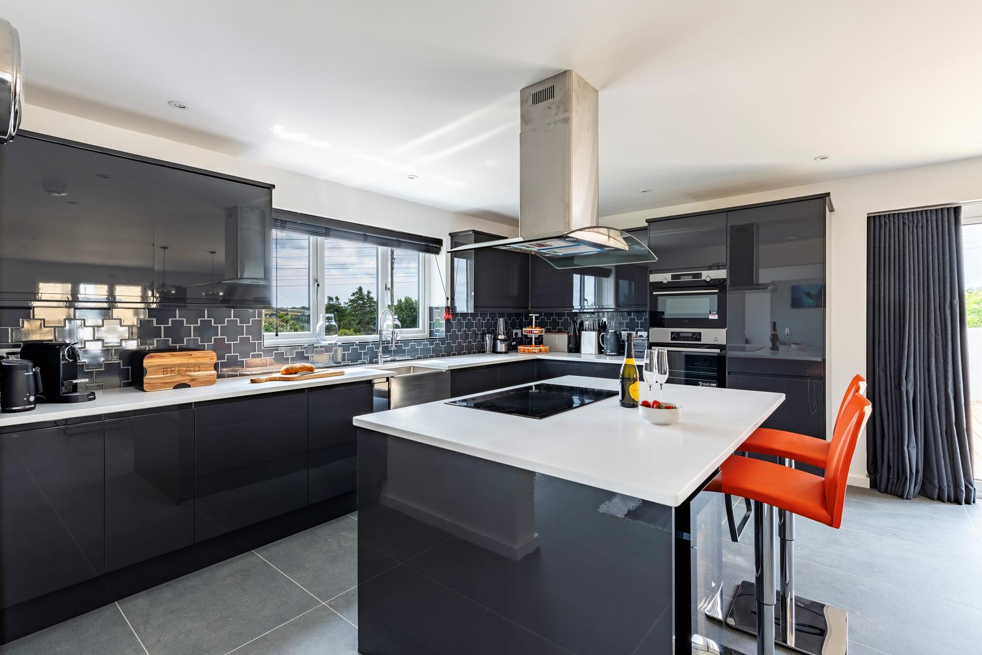 The kitchen is modern and sleek and has all you need to cook tasty meals.