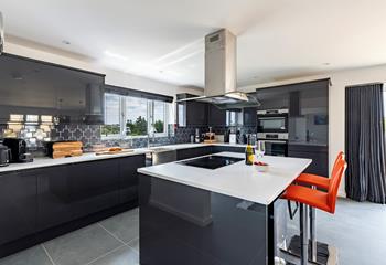 The kitchen is modern and sleek and has all you need to cook tasty meals.