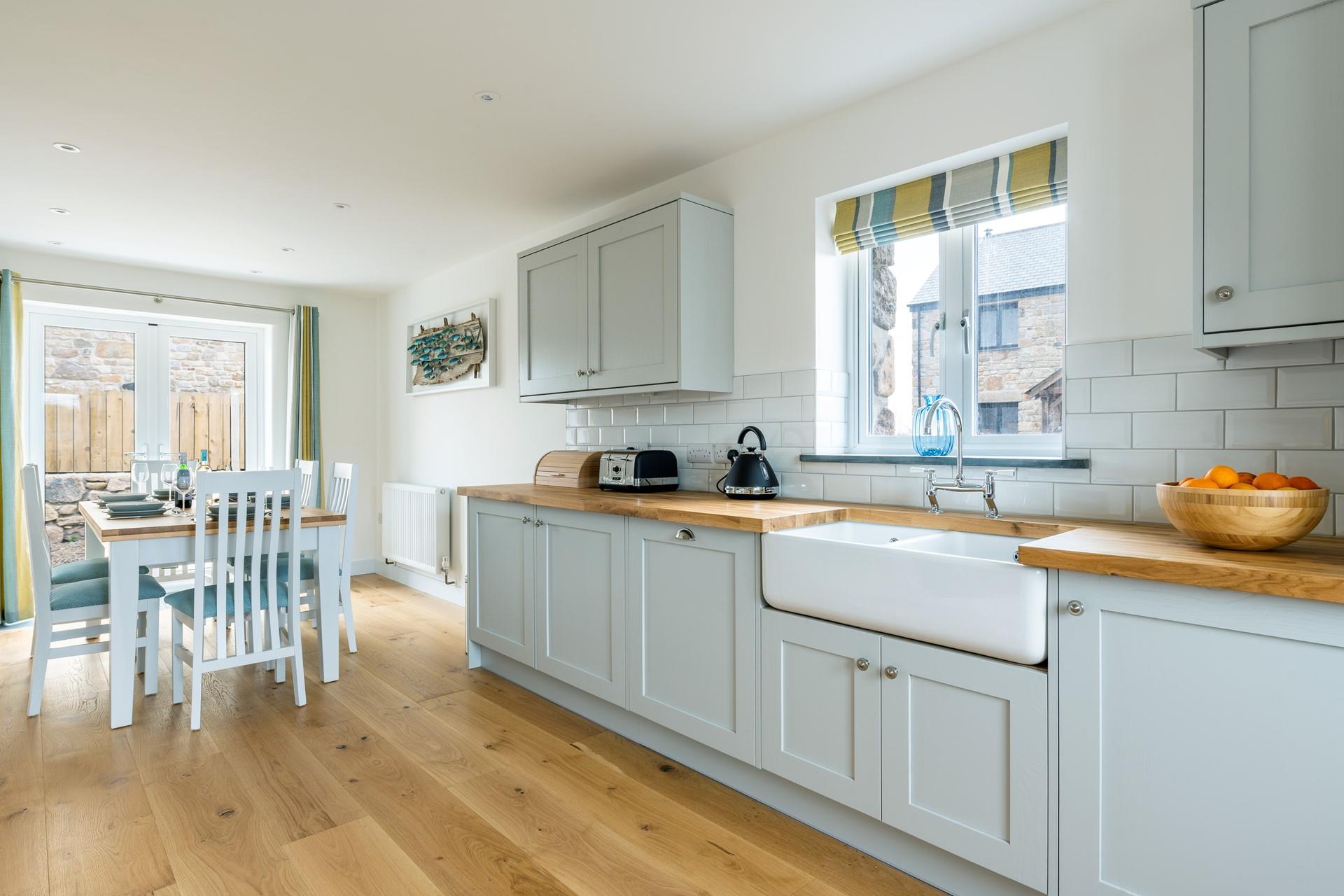 The kitchen is modern and well-equipped for cooking up a storm.