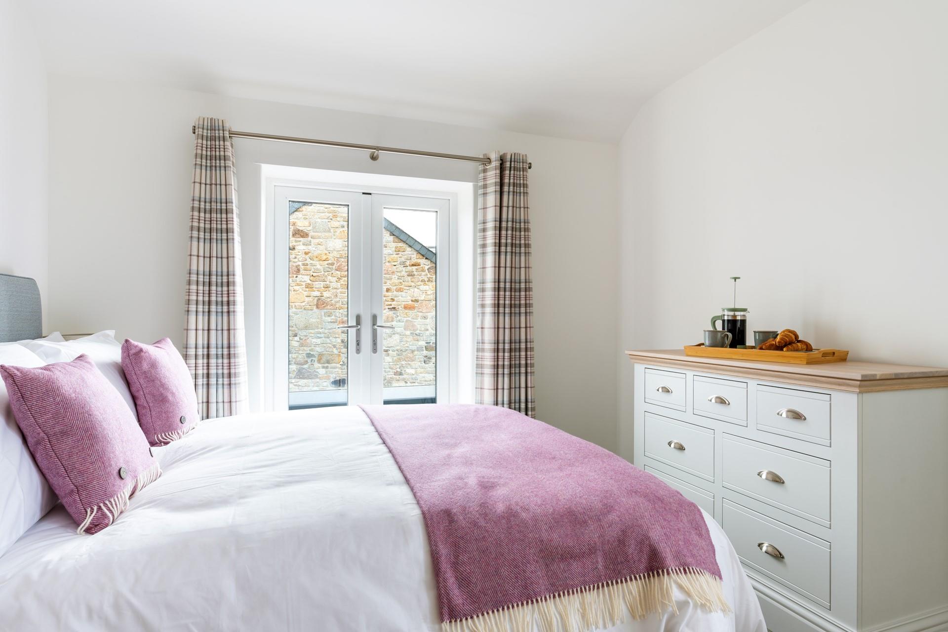 Climb into the king size bed and drift into a dreamy night's slumber in the soft sheets.