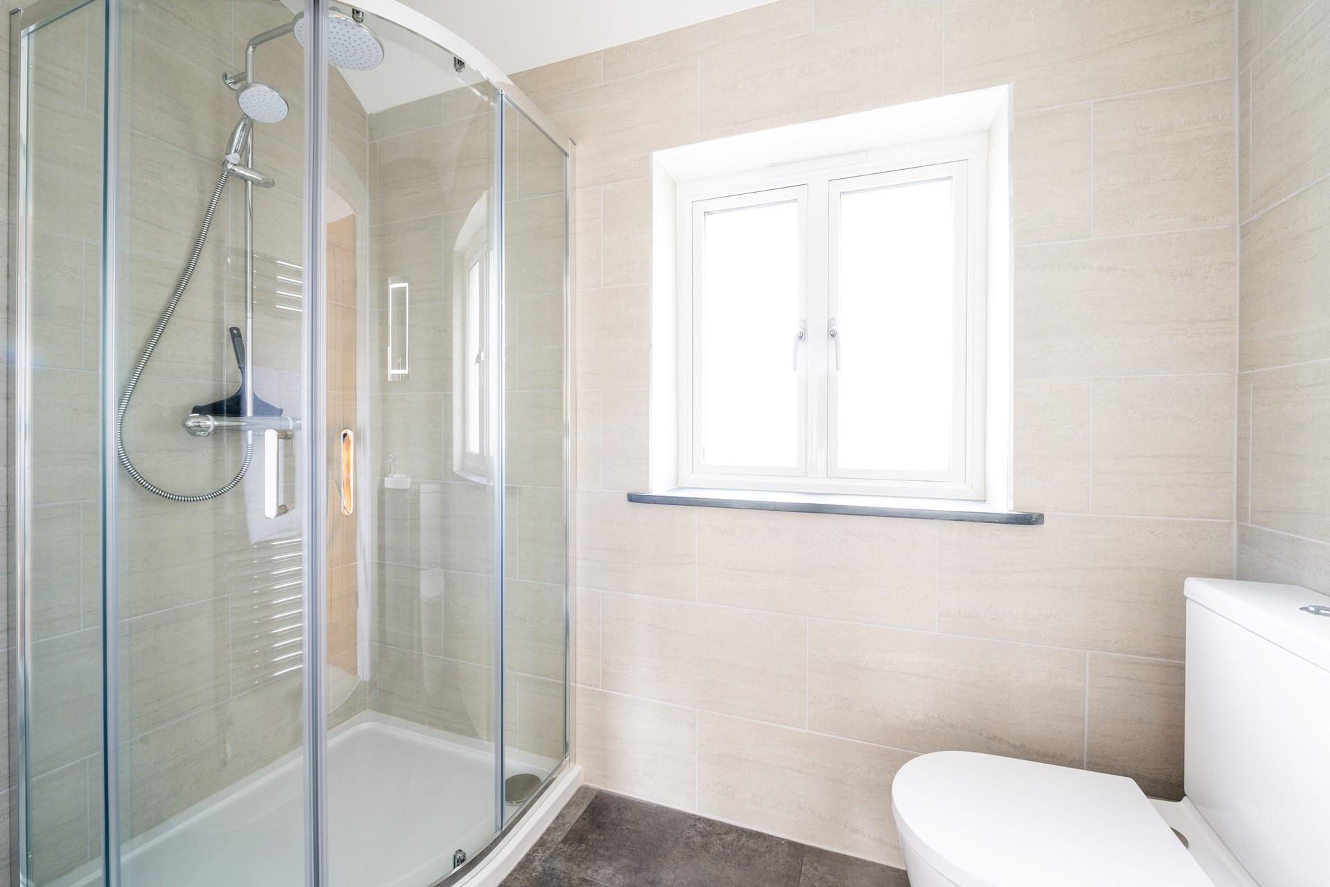 Wash off sandy toes in the shower after a day spent on a nearby beach.