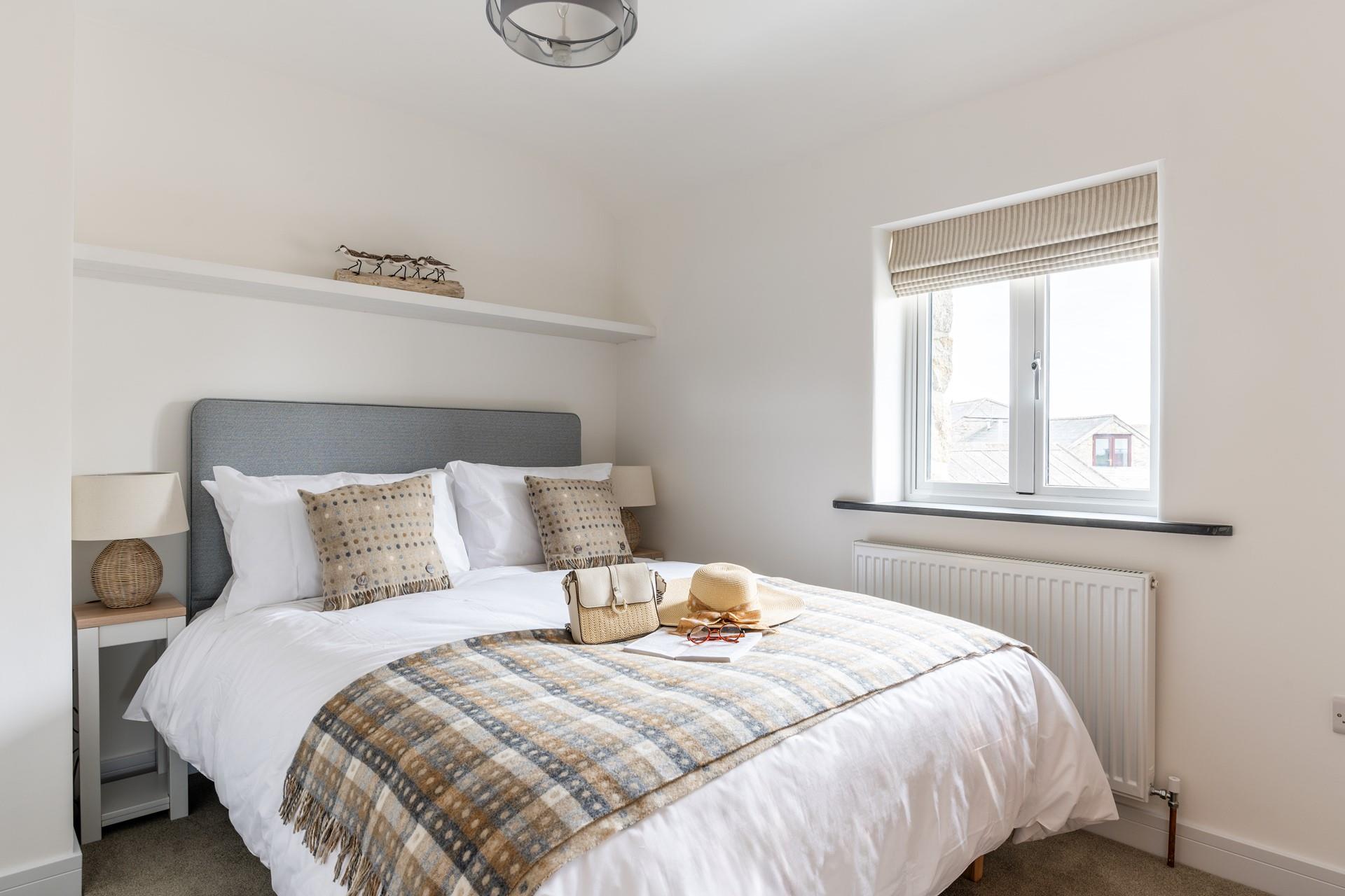 Bedroom 2 has a comfortable king size bed and sea glimpses to wake up to.