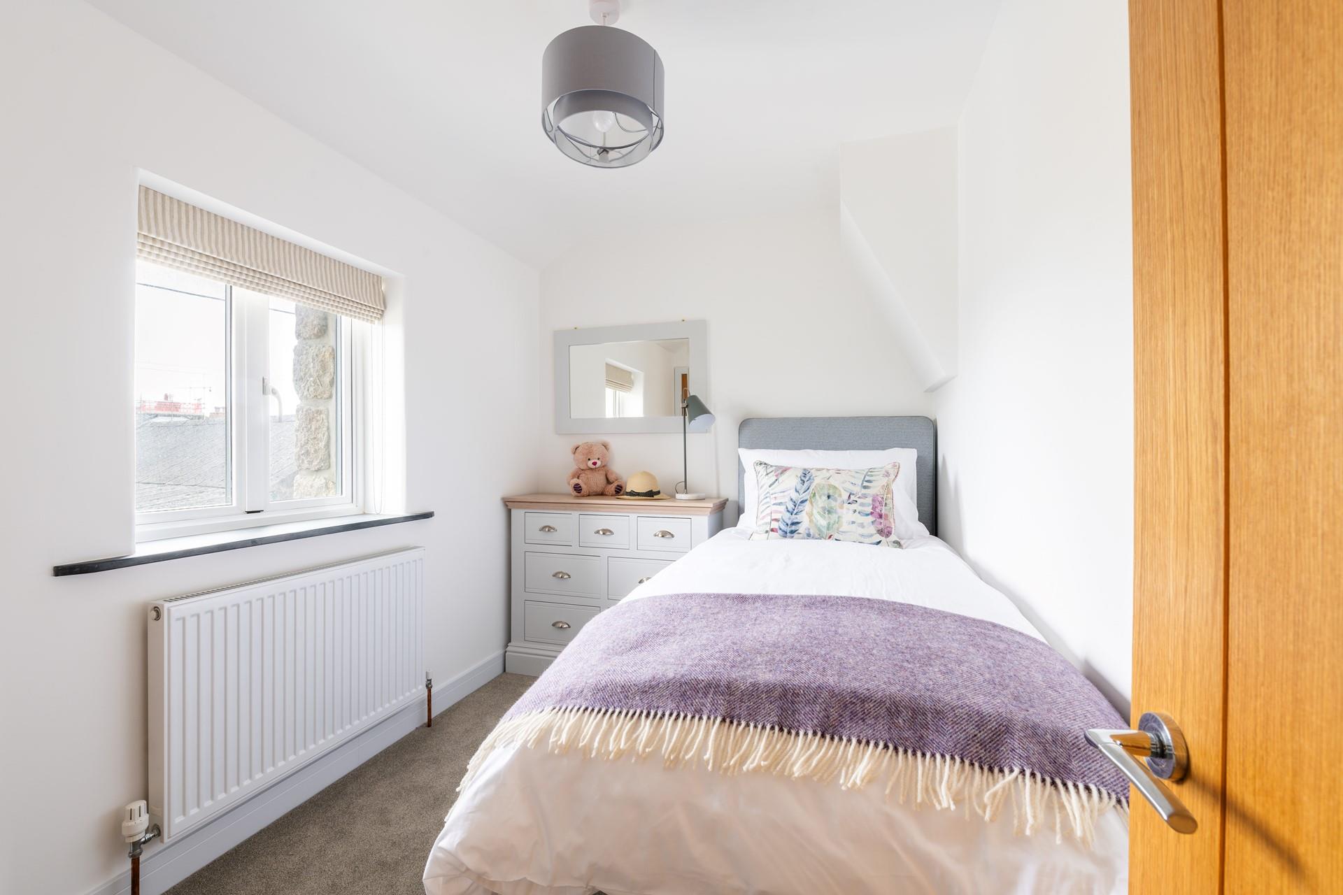 Bedroom 3 has a single bed and is perfect for adults or children.