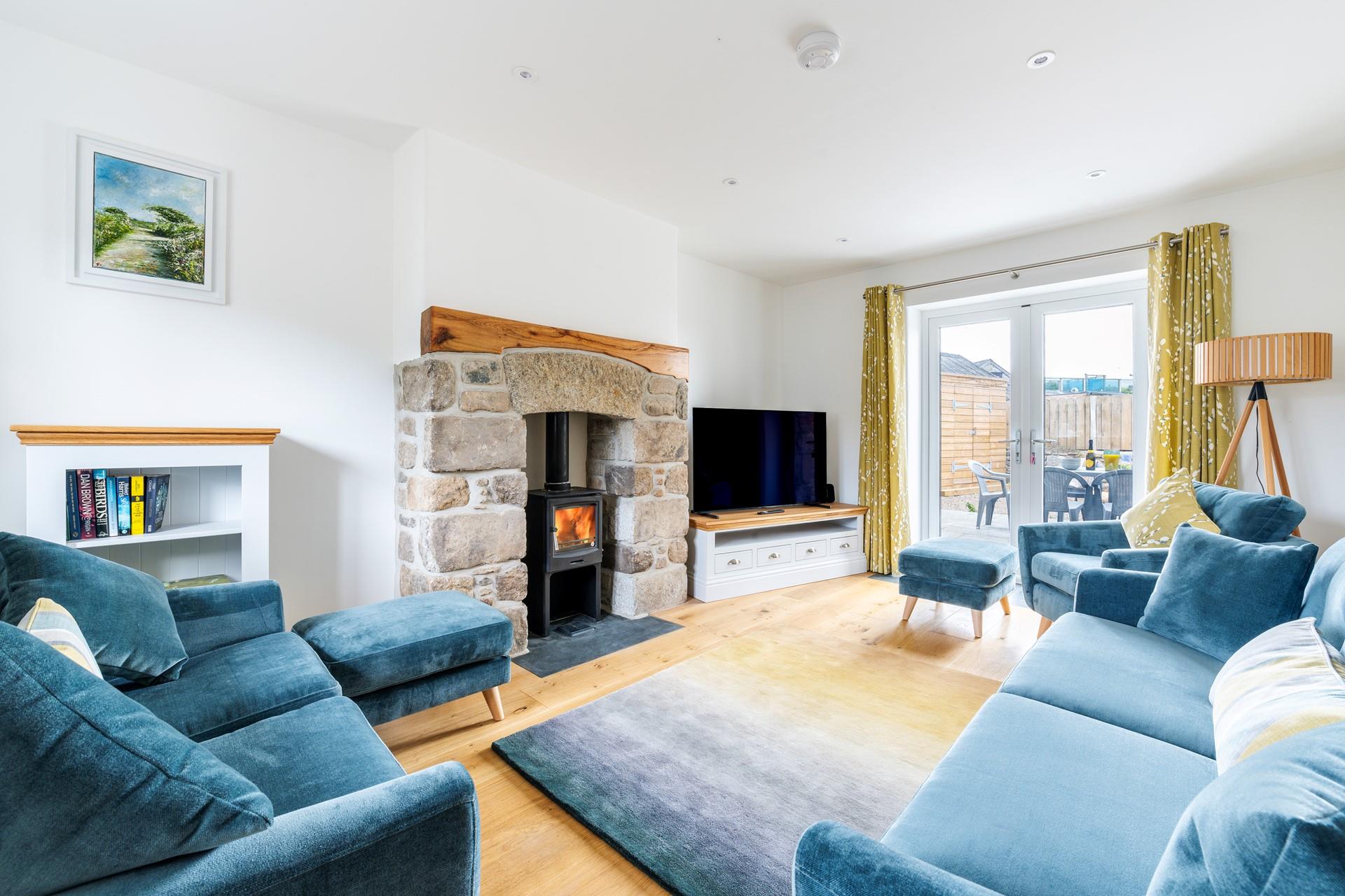 Light the wood burner and snuggle up in the cosy and stylish sitting room in the evening.