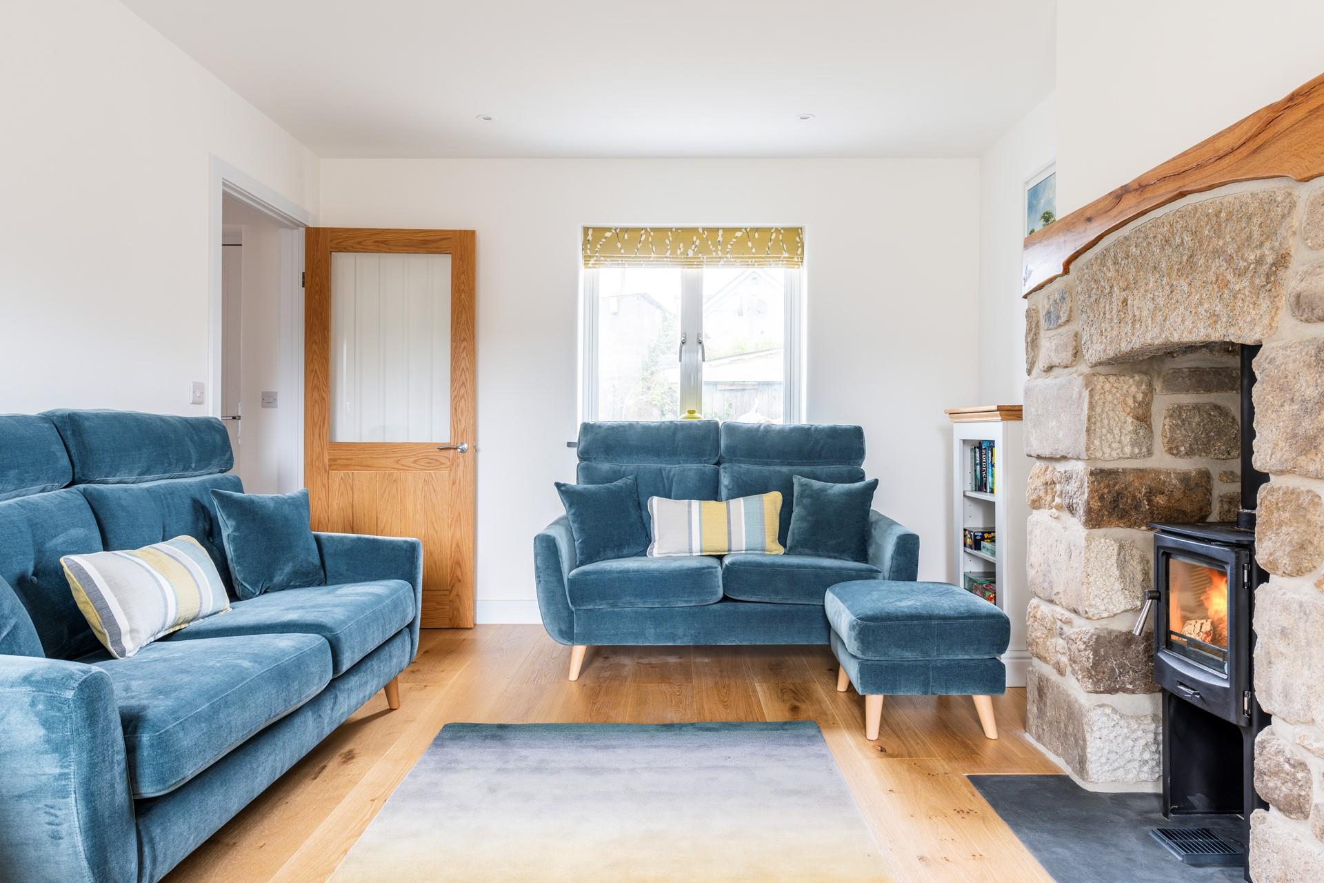 Snuggle together for a family games night in front of the crackling woodburner.