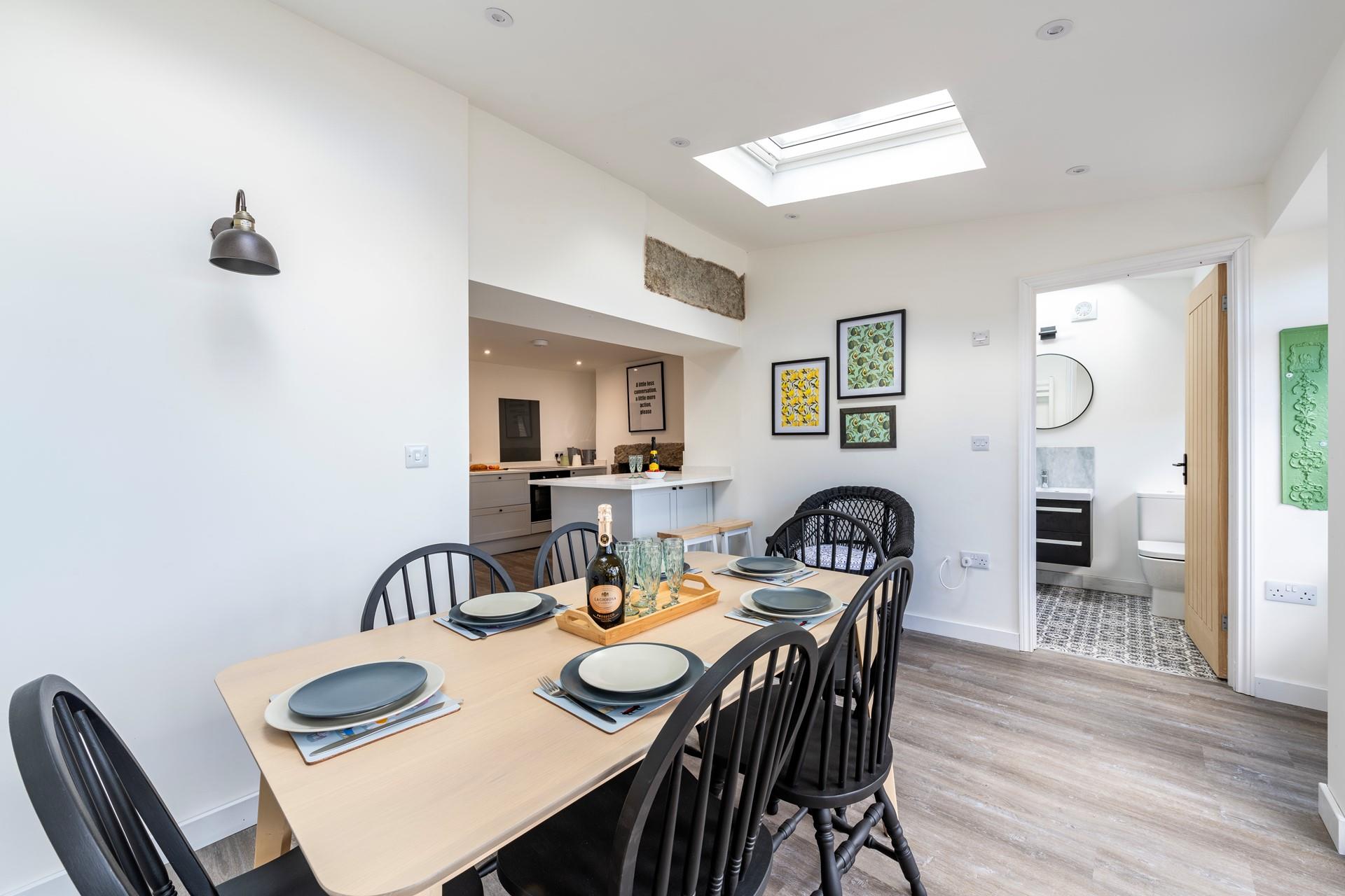 The open plan dining and kitchen area means you can cook and dine together as a family.