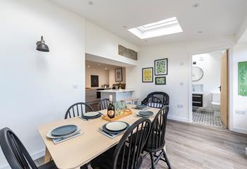 The open plan dining and kitchen area means you can cook and dine together as a family.