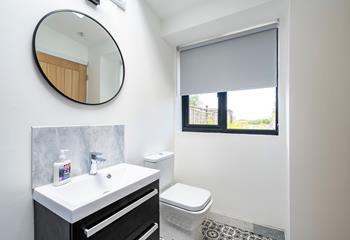 The modern bathroom provides a great space to get ready for the day.
