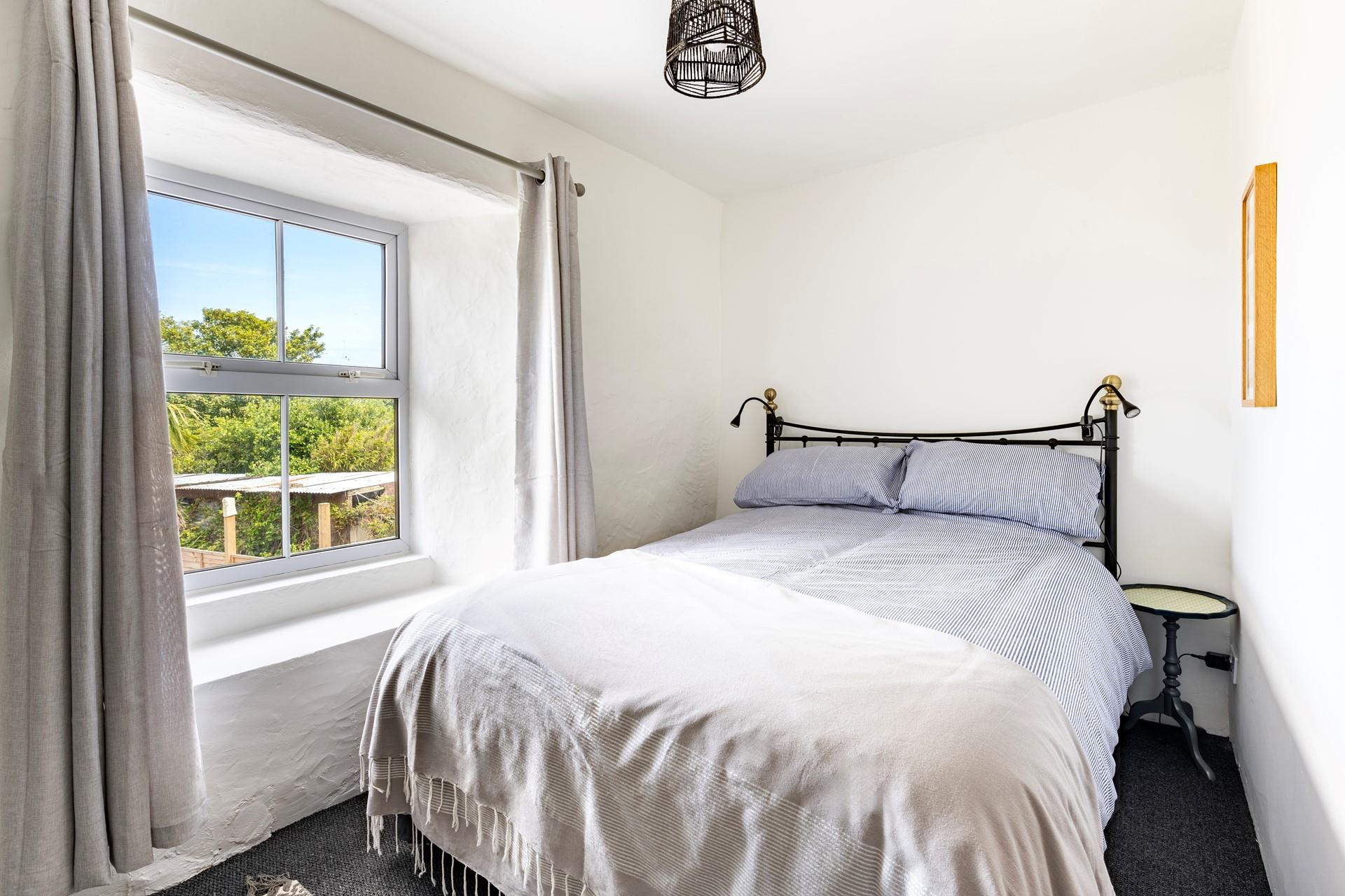 Bedroom 2 also has a spacious double bed to tuck into each night.