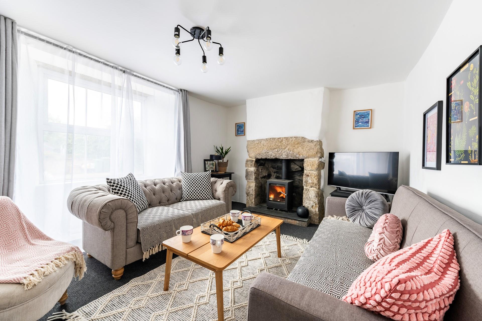 The sitting room is stylishly decorated with cosy interiors and is the perfect spot to unwind.