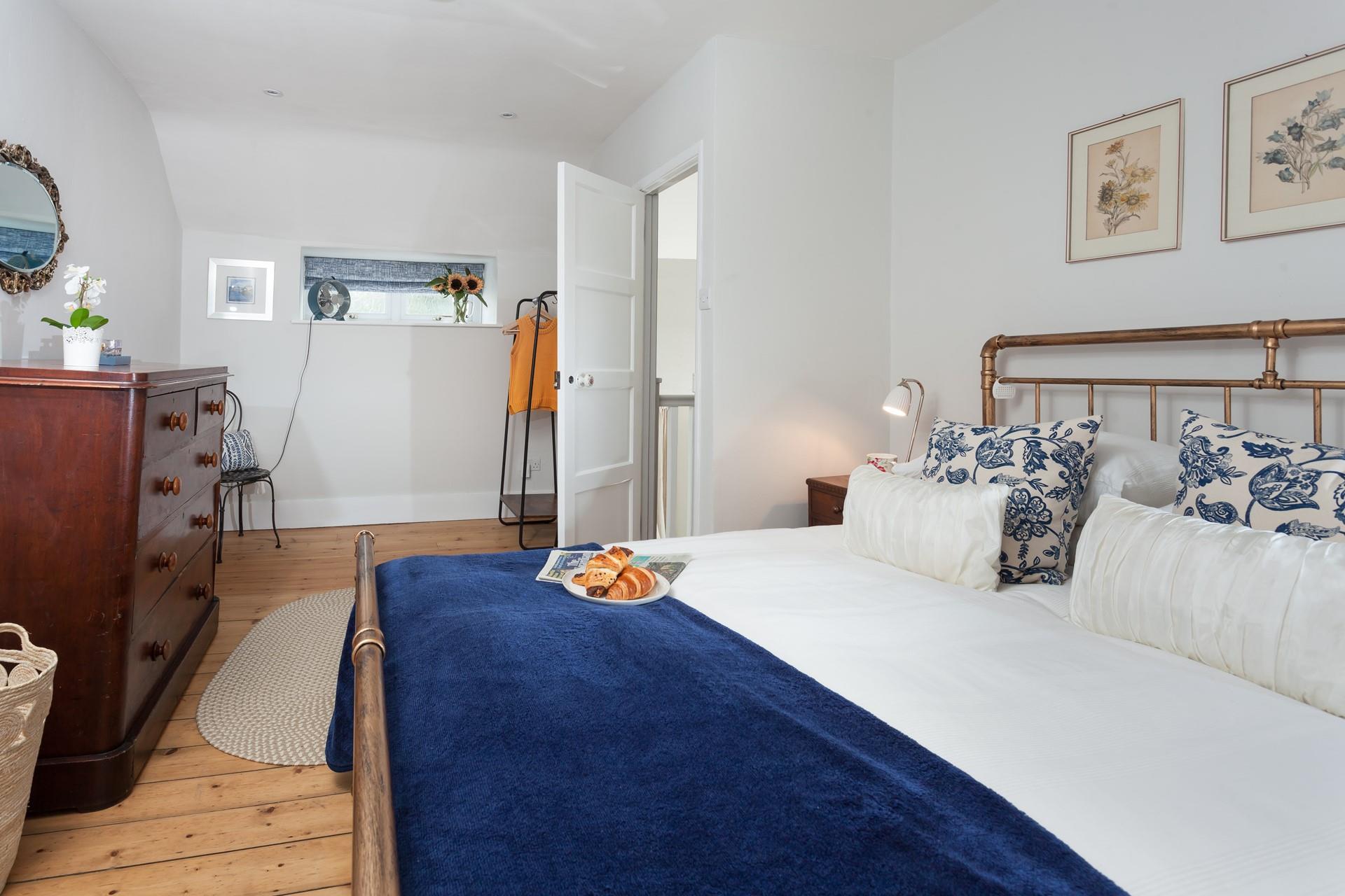 Bedroom 1 is a stunning mix of old and new.